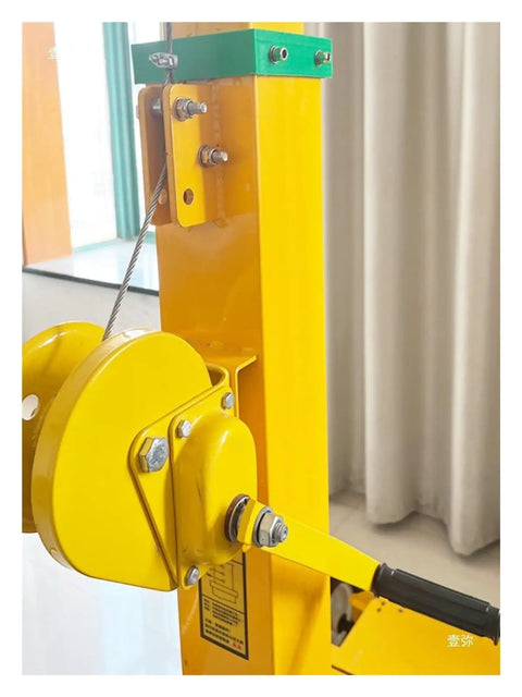 Close-up of Manual Crank Telescopic Light Pole, featuring yellow body, pulley, and self-locking mechanism.