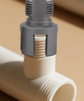 Heavy Duty Integrated Internal And External Pipe Threading Tool Set With 1/2" 3/4" 1" Dies on white plastic pipe joint.