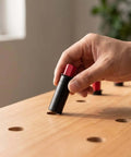 Hand placing Retractable Table Stop For Woodworking, Matte Black Bench Stop with 20mm bench dog into wooden workbench hole