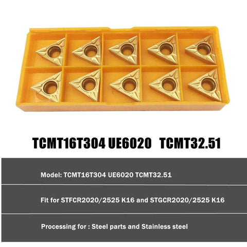 Ten TCMT32.51 carbide external turning inserts in a yellow plastic holder
