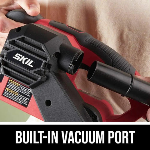 Hand holding Beast 6 Amp Belt Sander with built-in vacuum port, showcasing micro filtration dust system for smooth wood finishes.
