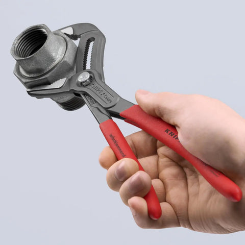 Cobra ES Extra-Slim 10 Inch Pump Pliers with narrow jaws gripping a metal pipe, ideal for screws, bolts, and wire rope.