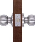 Set Of 4 No Fuss Satin Nickel Privacy Door Knobs With Adjustable Latch Fits Standard Backsets For Bedroom And Bathroom Doors Easy Install With Screws And Instructions viewed side profile installed on wood door