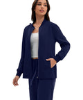 Women Go To Zip Front Scrub Jacket Four Pocket Medical Top Ultra Soft Stretch Uniform Coat, navy color, model wearing with four pockets.