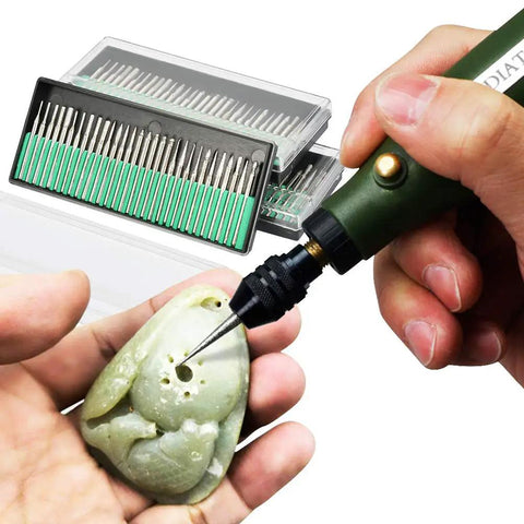Person using 90 Pc Diamond Burr Bits Kit For Engraving And Carving On Glass Gemstone Metal with rotary tool on stone