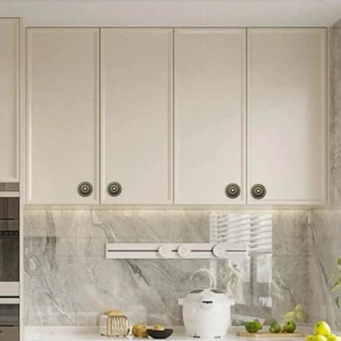 Vintage Bronze Cabinet Knobs Set For Dresser And Cupboard installed on white kitchen cabinets, 1.22 inch diameter, zinc alloy hardware.