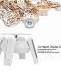 Solar Powered Jewelry Display Stand With 360 Degree Rotating Turntable And Blue LED Lights Electric Base showcasing rings and chains.