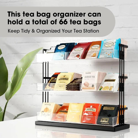 Three Tier Tea Bag Organizer With Clear Acrylic Compartments And Black Steel Frame Holds 15 Compartments For Coffee Station Storage On Countertop Or In Cabinet Great For Office And Kitchen displayed with various tea bags.
