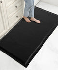 Person standing on black 3x5 Ft Anti Fatigue Floor Mat 15/16 Inch Thick Diamond Plate Non Slip Ergonomic Standing Mat For Industrial Grade Use