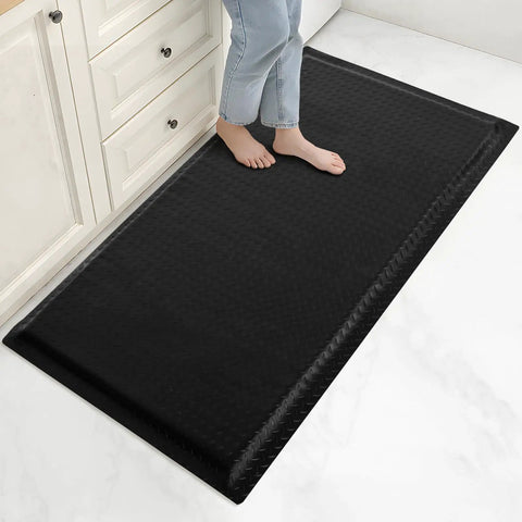 Person standing on black 3x5 Ft Anti Fatigue Floor Mat 15/16 Inch Thick Diamond Plate Non Slip Ergonomic Standing Mat For Industrial Grade Use