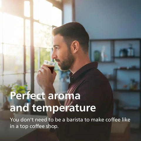 Man enjoying coffee in bright kitchen, showcasing Fully Automatic Espresso Machine With One Touch Milk Frother And Quiet Ceramic Grinder Crafts Top Shelf Coffee Fast Ideal Iced Coffee Maker And Low Noise Kitchen Setup For Daily Grind Certified Renewed Gem.