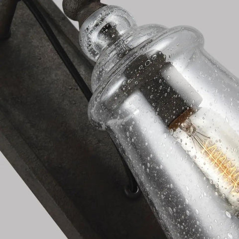 Close-up of Loras One Light Wall Sconce In Traditional Style With Weathered Iron Finish, showing clear textured glass detail