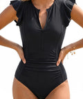 Black Zip Front One Piece Swimsuit With Rash Guard Short Sleeve For Women Built In Padded Bra Tummy Control Surfing And Water Sports Bathing Suit For All Day Beach Vibes shown from front view