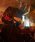 Welder wearing BSX 9 Oz Contoured Flame-Resistant Cotton Welding Jacket With Welder's Collar, Dual Scribe Pockets, 2X-Large Black