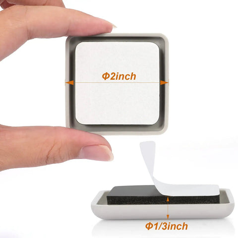 Hand holding a 2-inch square beige furniture slider with adhesive back, showing depth and backing of Furniture Sliders For Carpet And Hardwood Floors 16 Pack 2 Inch Square Movers So You Can Glide Heavy Furniture Effortlessly Without Scratching Floors And Keeping Noise Low.