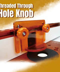Close-up of T-Track Knob Kit With 1/4-20 Threaded Knobs, T-Bolts and Washers, installed on woodworking jig, orange star knobs visible.