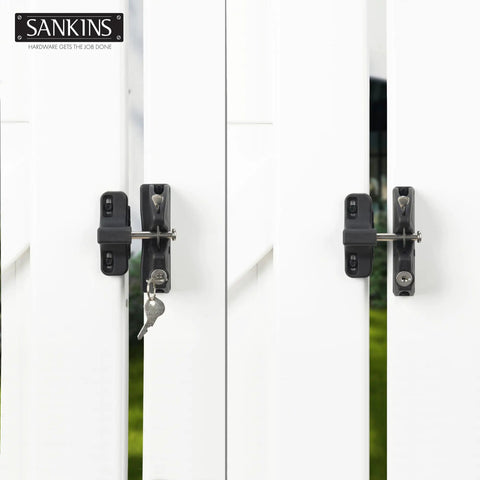 Heavy Duty Key Lockable Double Sided Gate Latch For Outdoor Fences secures yard, black latch installed on white wooden fence.