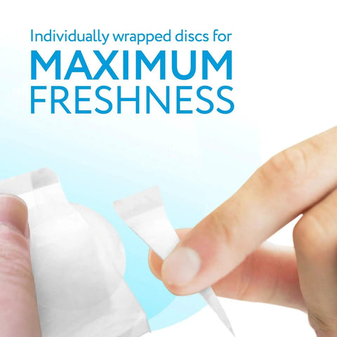 Hand opening a steam mop fragrance disc in Spring Breeze scent for fresh floors compatible with Bissell models, 15 pack.