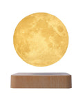 Levitating Moon Lamp With Hovering Glow, Rotates In Air, LED Table Night Light on wooden base in yellow light mode
