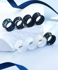 Assorted black and white silicone ear gauges with marble patterns on display. Silicone Ear Gauges Tunnels Plugs For Ears 10mm 00G.