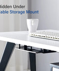 Prime Desk Real Estate Saver This Under Desk Laptop Mount is hidden under a table, showcasing black steel design for laptop storage.