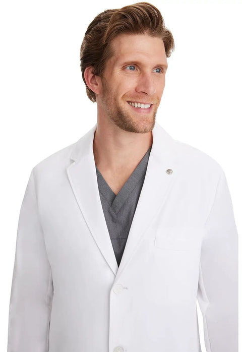 Portrait of man wearing Men's White Lab Coat With 5 Pockets, 360 Degree Stretch, Knit Details, Relaxed Fit, 34.5 Inch Back Length