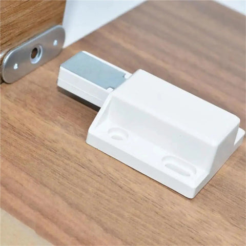 Magnetic Touch Cabinet Latch Hands Free Opening No Fuss No Handle Design Easy Install Push To Open Release Lock in white on wood surface