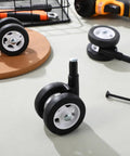 Four Pack White Twin Swivel Caster Kit For Baby Walker Replacement Wheels Runs Slick On Any Floor Premium Built Zero Fuss Easy Swap Stroller Parts with black rubber wheels.