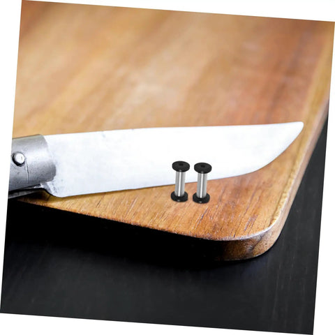 Top Tier Flat Head Knife Handle Screws Coupled With Heavy Gauge Stainless Steel Bolts Lock Down Blade Stability With Quick Thread Adjustments Tight Grip Badass Toolsmith Supply Pack resting on wooden cutting board beside knife.