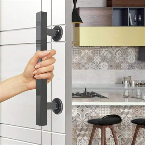 Person gripping stainless steel glass door handle set for home and barn doors 30cm alloy push pull hardware with easy grip interior door pull handle hotel grade durable door accessories.