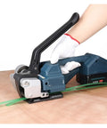 Portable Electric Strapping Machine With Two Batteries For PP PET Band Belt Packing Tools, used to secure green strap.