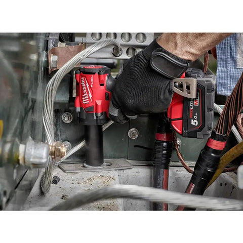 Ultra Compact M18 FUEL Three Eighths Inch Friction Ring Impact Wrench With Tri LED Lighting For Tight Spaces Bare Tool Only No Charger No Battery For Onsite Work in use in a tight mechanic space.