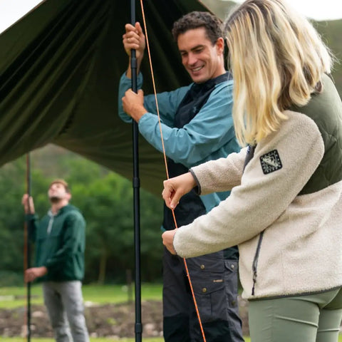 People setting up canopy with adjustable aluminum telescoping tarp poles for tarps canopies and awnings, heavy duty 4 section pole.