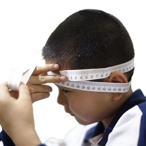 Child's head being measured with Disposable Paper Tape Measure for Medical Use 40 Inch by Three Quarter Inch Write On Tape