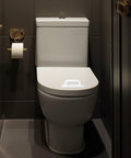 Two Pack Adhesive Cabinet Handles Stick On No Drill Pulls installed on white toilet seat in modern bathroom setting