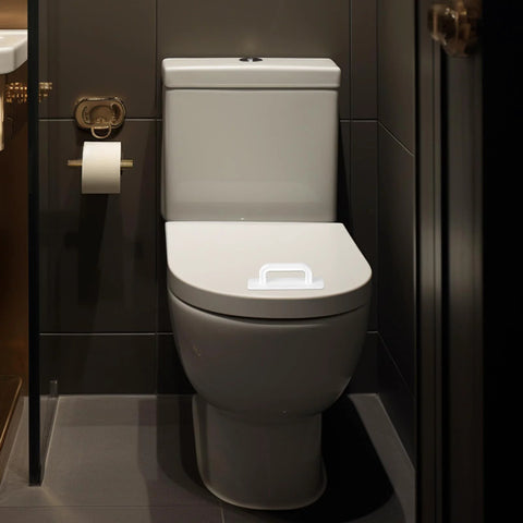 Two Pack Adhesive Cabinet Handles Stick On No Drill Pulls installed on white toilet seat in modern bathroom setting