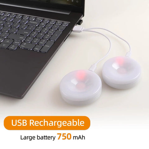 4 Pack Rechargeable Puck Lights With Remote And Touch Control connected to laptop via USB