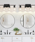 Sleek Matte Black Four Light Bathroom Vanity Wall Lamp With Thick Clear Glass Shades For Mirror Or Porch, view over vanity.