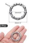 Bicycle Crank Ball Bearing Set One Fifth Inch 6mm Ball Size With Nine Balls Per Bearing Two Pack held in hand, dimensions shown