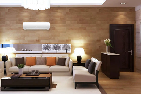 24000 BTU Wall Mount Ductless Mini Split Air Conditioner And Heat Pump features modern indoor unit above a stylish living room sofa.