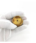 Gloved hand holding watch movement holder tool for NH35 7750 3135 repair, gold precision aluminum alloy piece, metal base fitting stand