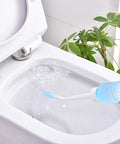 Big Capacity Portable Bidet Bottle With Retractable Nozzle 560 Ml 18 Oz in use, spraying water into a toilet bowl