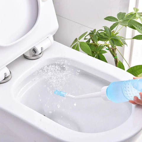 Big Capacity Portable Bidet Bottle With Retractable Nozzle 560 Ml 18 Oz in use, spraying water into a toilet bowl