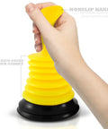 Tiny 7 Inch Sink Plunger with Ergonomic Grip No Sweat Mini Clog Remover held in hand, bright yellow design and black rubber base.