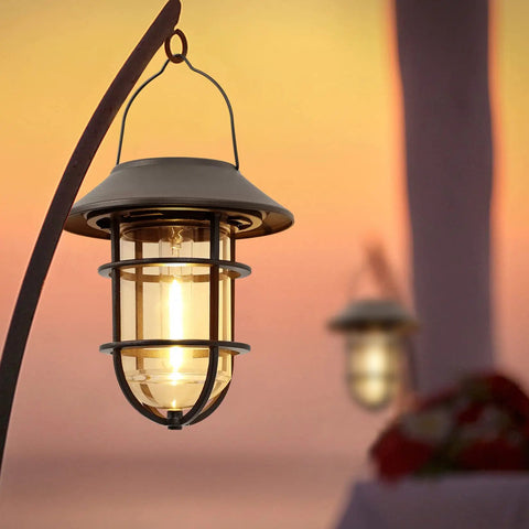Solar Outdoor Lights Hanging Lanterns Two Pack Waterproof Easy Install With Wall Mount Kit illuminating at sunset