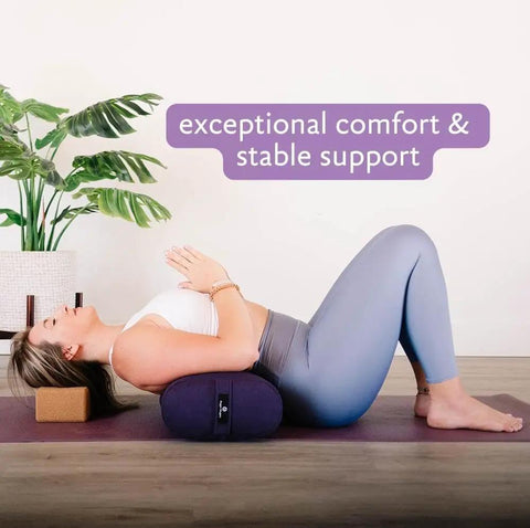 Beefy Rectangular Yoga Bolster For Deep Restorative Poses Ultra Firm Foam Core With Cotton Cover Handmade In The USA Black 25 In By 11 In By 5 In 5 Lb Restorative Pillow You Can Count On. Woman using black rectangular yoga bolster for deep restorative pose