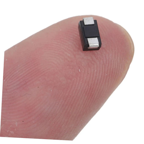 Heavy Duty US1K 1A 800V Rectifier Diodes 100 Pack on fingertip, small SMD diodes for electronics, 5mm x 2mm size.