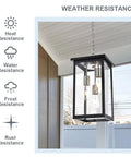 3 Light Outdoor Pendant Light Fixture In Black And Brushed Nickel Finish With Clear Glass Hanging on Patio Ceiling