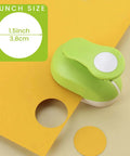 Green 1.5 Inch Circle Punch With Lever Handle for clean even circles in scrapbooking and DIY projects on yellow paper
