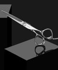 Polished Silver Japanese Steel Hair Cutting Shears With Beveled Blade For Wet And Dry Hair displayed on a reflective surface.